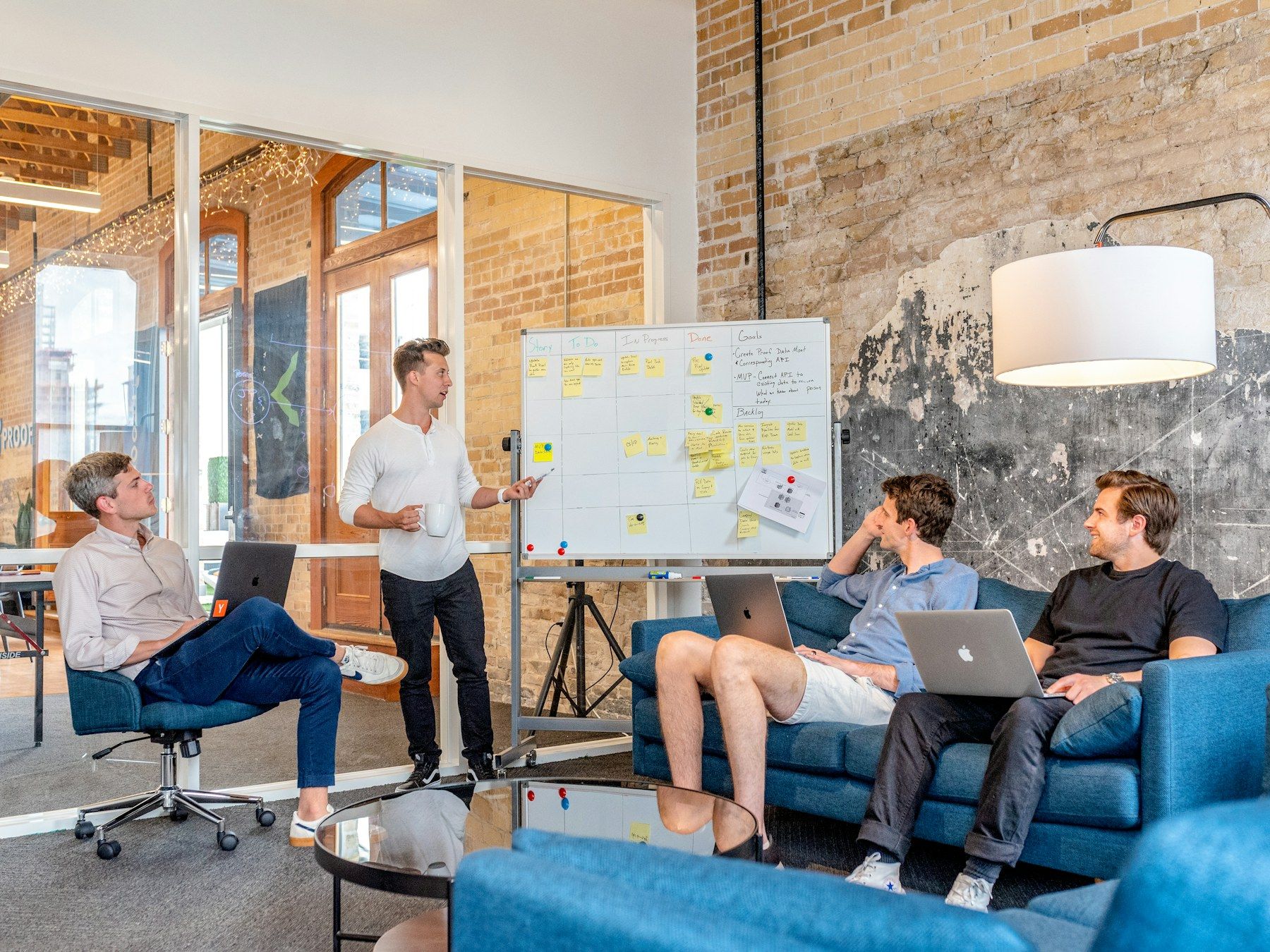 A team reviewing a workflow board in a bright office