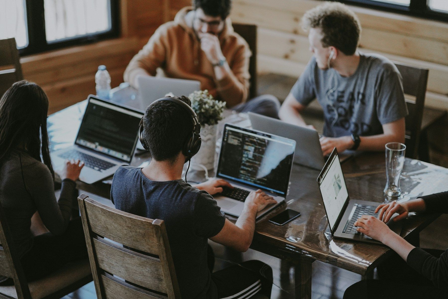 Colleagues working together around a table in a bright workspace